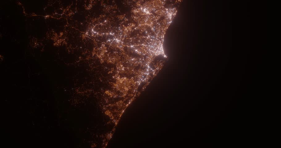 Durban (South Africa) aerial view at night. Satellite view on modern city with street lights. Camera is flying above the city, moving forward