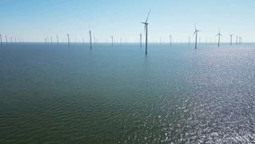 Green energy, wind turbines produce energy in the North Sea, wind farm power plant view from height, alternative energy sources. - Powered by Shutterstock - Get 15% off with code: PIKWIZARD15