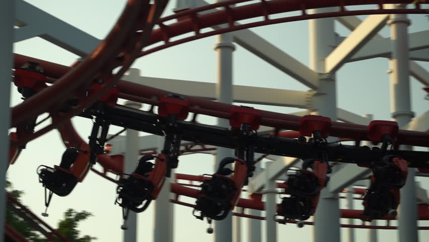 Ride a roller coaster at an amusement park.