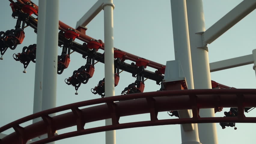 Ride a roller coaster at an amusement park.