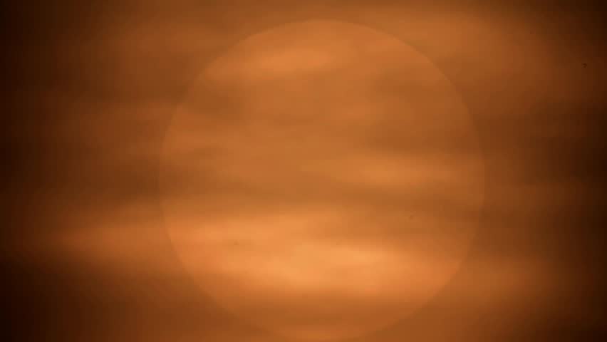 The sun sets in the afternoon so it turns orange
