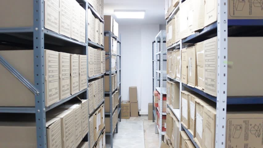 Interior of an archive with several cardboard boxes on shelves inside a public library in Neiva, Huila, Colombia. Concept of education and backgrounds