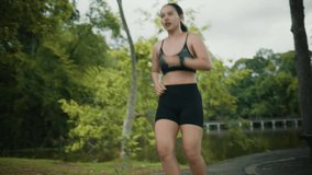 Exhausted young woman stopping to catch her breath during an intense morning run. She checks her heart rate on a smartwatch and smiles - Powered by Shutterstock - Get 15% off with code: PIKWIZARD15
