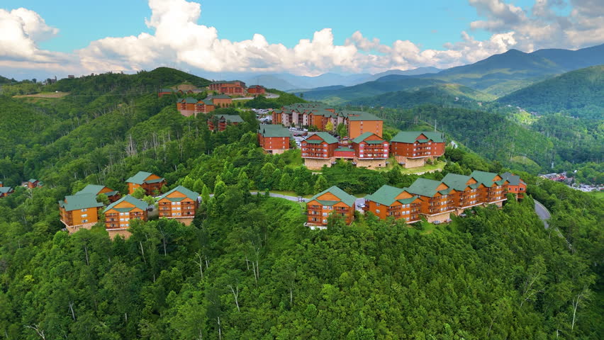 Beautiful homes in Gatlinburg, Tennessee nestled in the Great Smoky Mountains with scenic forest landscape and summer colors