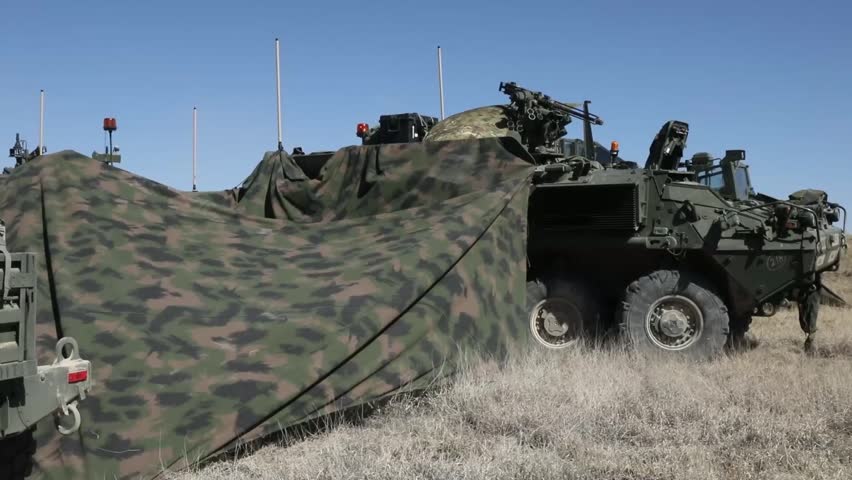 Soldiers position their Stryker combat vehicles.