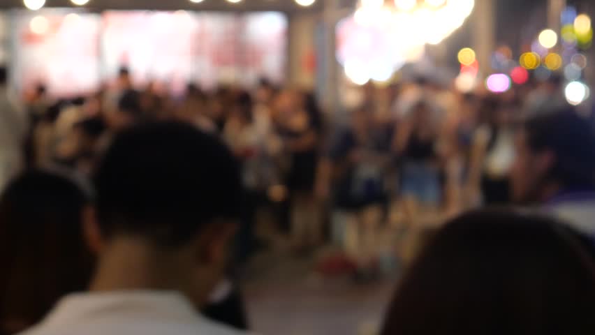 Crowd of Asian people crossing road