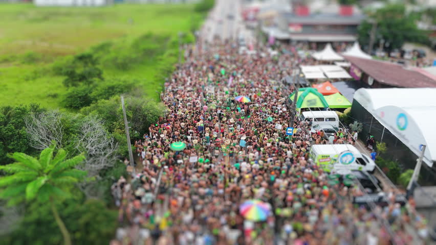 Aerial view of the street block carnival named Samambloco on the street of the town of Campeche, Florianopolis, Brazil