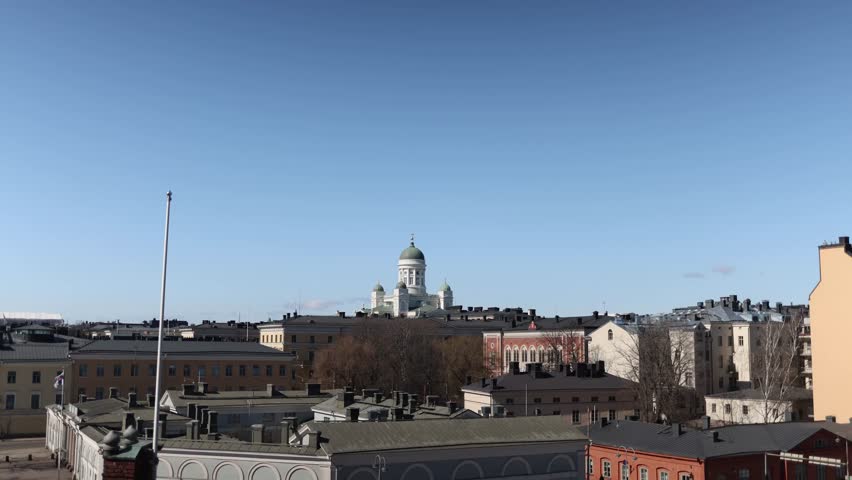 Slow cinematic approach toward Helsinki Cathedral majestic white church architecture against blue sky peaceful european city atmosphere famous travel landmark in daylight