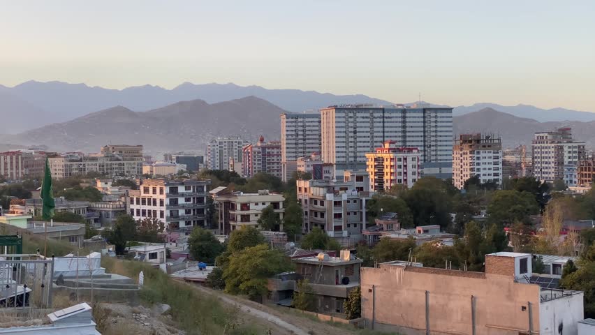 Modern apartment high-rises and hotels in Shahr-e Naw.Kabul. Afghanistan. Urban development, construction boom, and residential blocks against Hindu Kush mountains.
