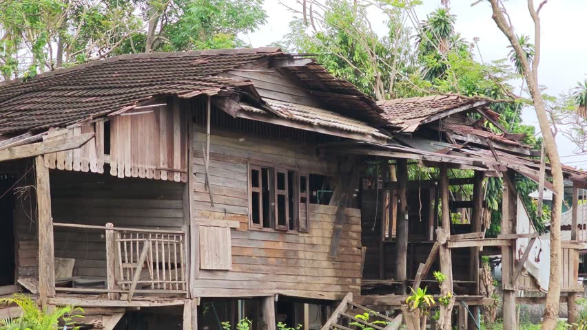 An old, dilapidated wooden house.