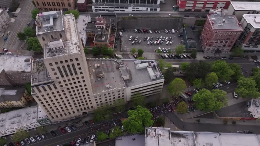 Crowd On The Street During May Day Protest Outside Tacoma City Hall In Washington, USA. aerial topdown, rotating shot