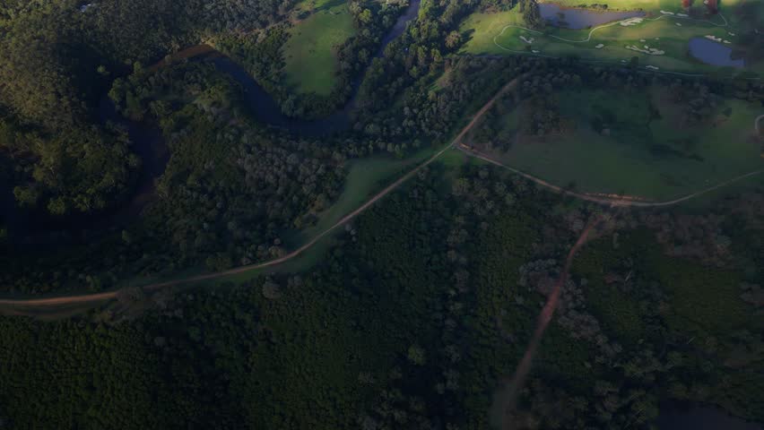 Aerial view flying over river and Mount Lofty 
