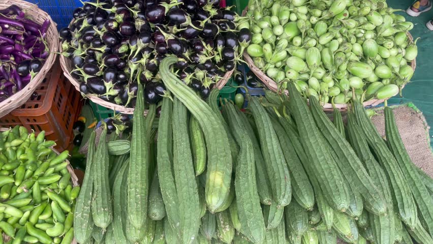Fresh Vegetables Display at Local Market with Carrots Radish and Egg plant	