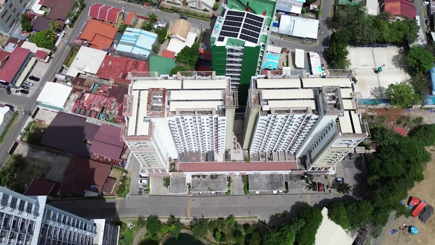 Drone flight above Cebu City center showing urban development, architecture in the Philippines.