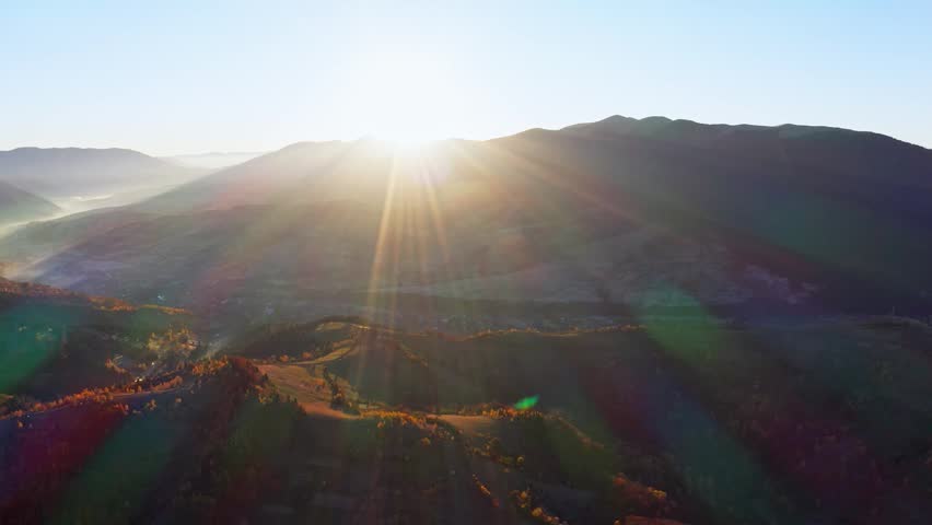 High mountains with terracota trees at bright sunrise