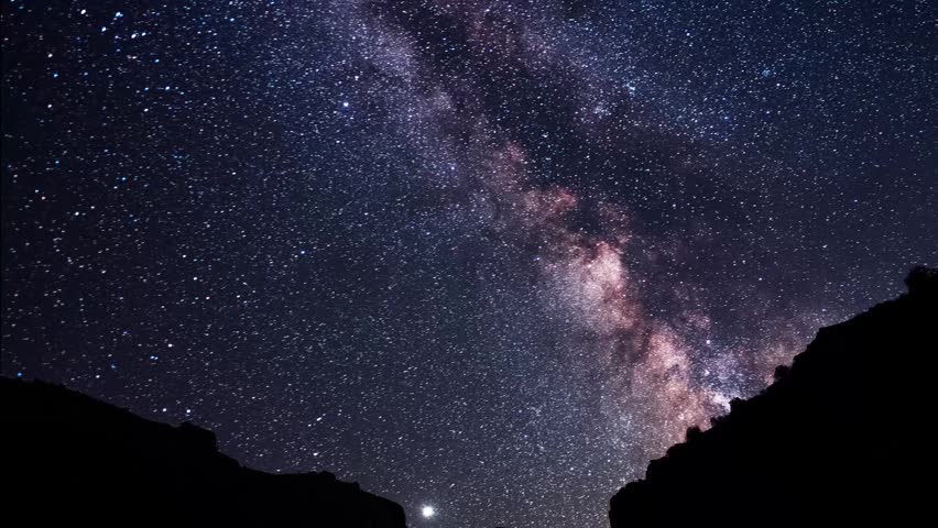 Night scene, mountains under bright colorful milky way galaxy. Space, night scene time lapse.