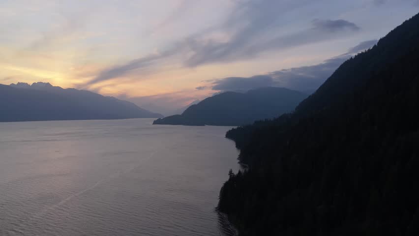 Majestic Sunset Over Serene Waters and Mountains in British Columbia, Canada