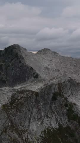 Majestic Rocky Mountain Landscape Under Clouded Sky in British Columbia, Canada
