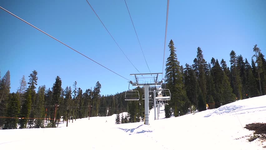pov riding a ski lift up the mountain