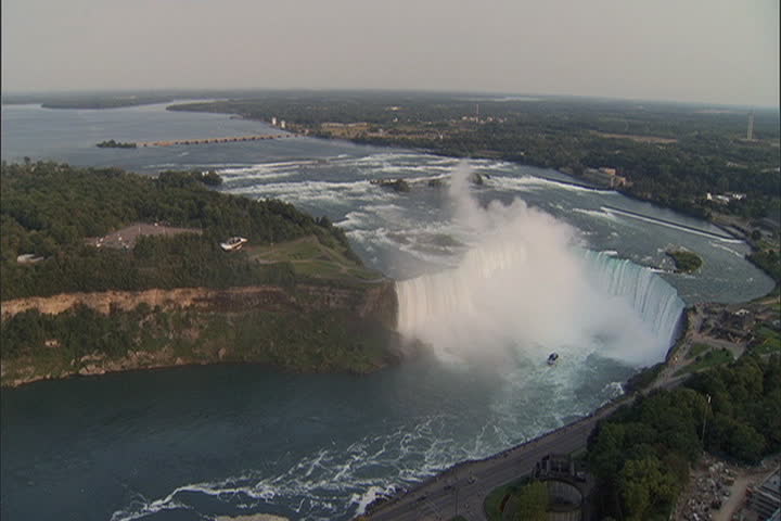 High angle view of river and Horseshoe Falls with lots of white mist rising from the falls at Niagara Falls, Ontario, Canada.