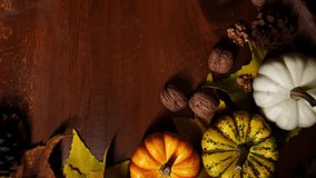 Decorative autumn wreath with mini gourds. Seasonal pumpkin and acorn display on wooden circular frame. Festive autumn decoration featuring miniature gourds and natural wooden circle embellishment - Powered by Shutterstock - Get 15% off with code: PIKWIZARD15