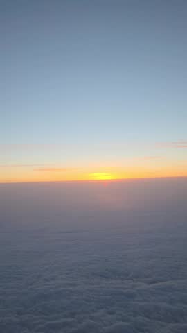 A view of the sunrise over the clouds