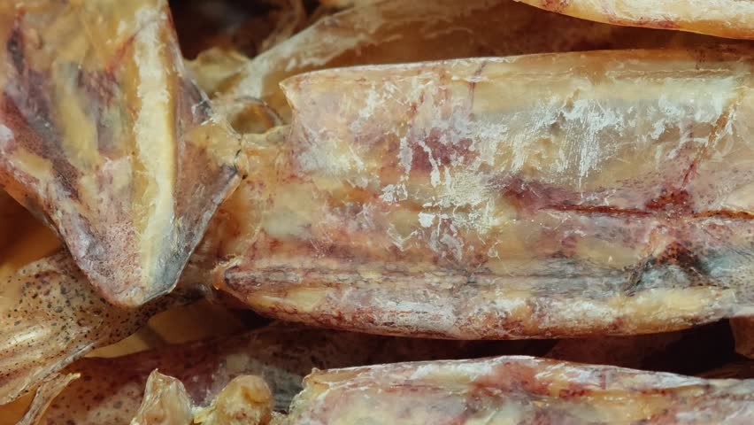 Dried squid on a basket.