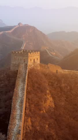Flying over the Great Wall of China at sunrise. Vertical Video,