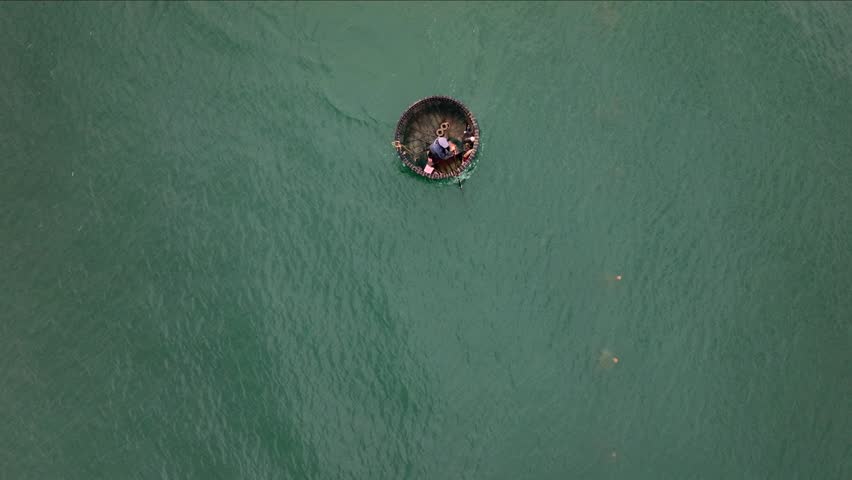 Vietnamese Fishermen in Traditional Thung chai Boat. The Sea near Da Nang city in Vietnam, Aerial Top VIew Drone Shot.