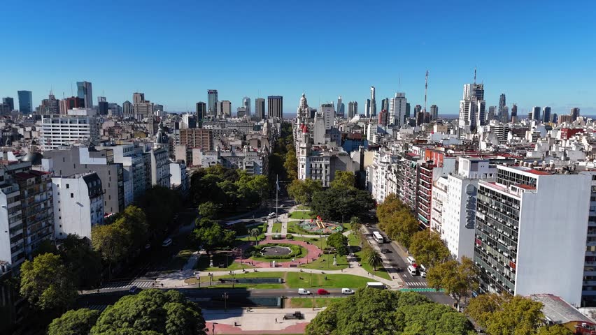 Aerial view flying over Plaza del Congreso towards the city skyline in Buenos Aires, Argentina