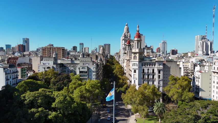 Beautiful cityscape of Buenos Aires with the Palacio Barolo and the argentinian flag waving