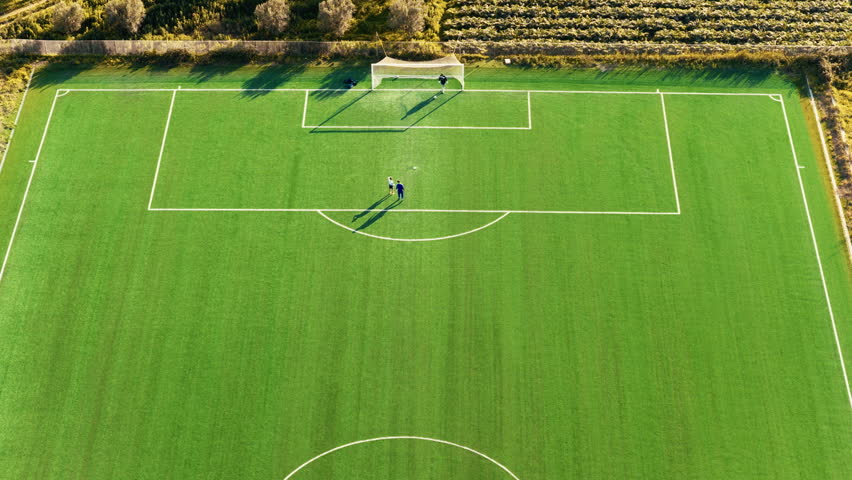 playing football in the artificial turf field