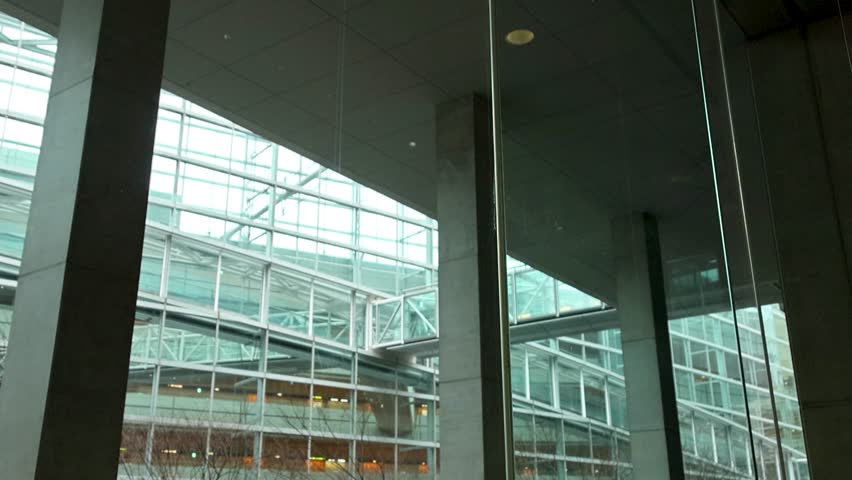 Tokyo modern glass architecture corporate glass rainy day Japan