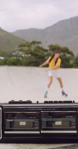 Spin, rollerskate and woman in park with music for skating, hobby and playlist on summer weekend. Skater, retro and person with radio for practice, sports and outdoor for skills, activity and trick