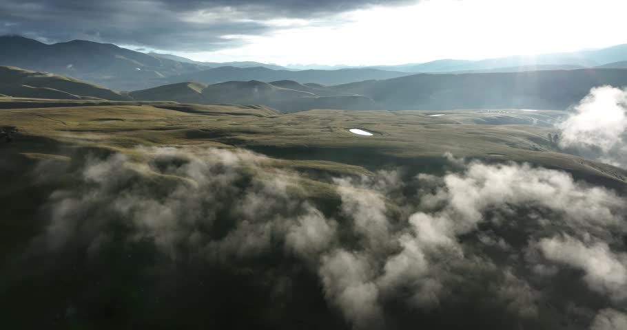 Aerial footage of beautiful high altitude grassland mountain landscape
