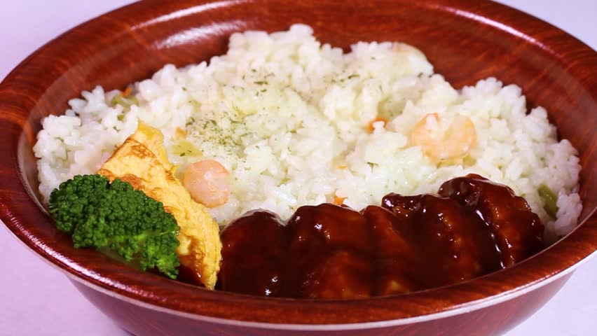 Takeout Bento With Hamburg Steak And Shrimp Pilaf Rotating On White Background