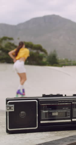 Blur, rollerskate and woman in park with radio for skating, hobby and dance on summer weekend. Skater, retro and person with music for practice, sports and spin for skills, activity and trick outdoor