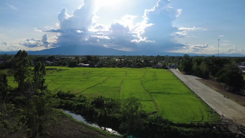 Aerial view of farmland and distant mountains