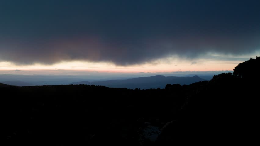 Sunset View on Mount Wellington kunanyi Hobart Tasmania with low cloud rolling in dark and moody
