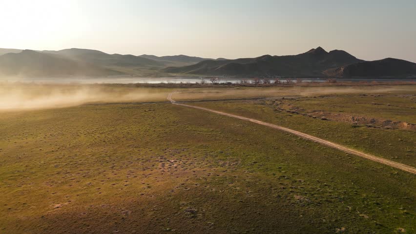 Drone shot of river Ili and spring steppe in Kazakhstan