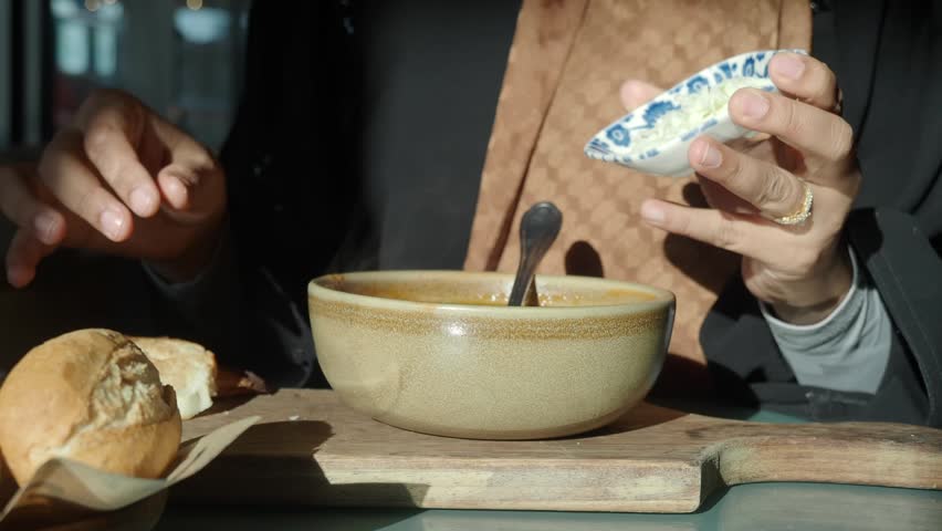 Enjoying traditional soup at a cozy cafe during lunch