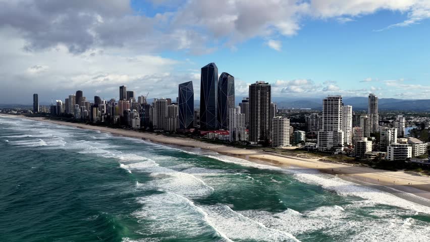 Fast aerial cityscape panorama of Gold Coast pacific waterfront Queensland, Australia