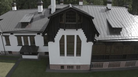 Drone Pulling Backward above Forest House Estate