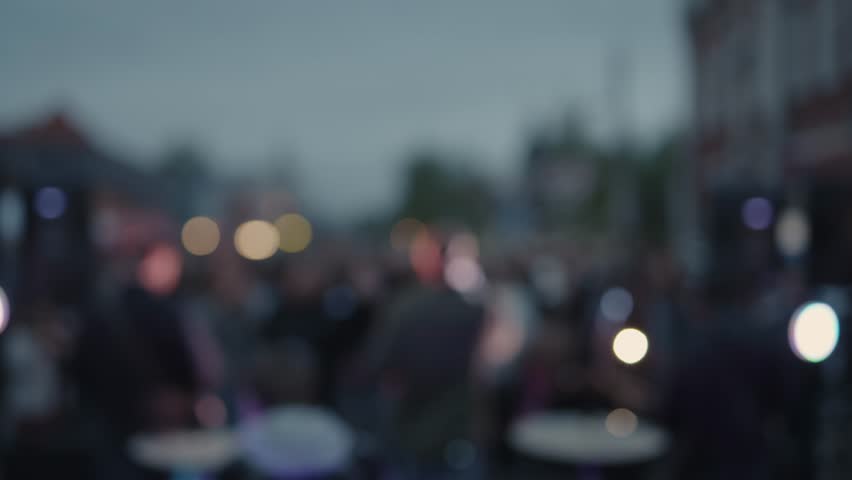 Cinematic shot of a band performing for a street crowd