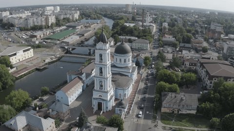 Drone Flying toward Cathedral above City River