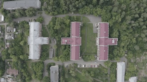 Descending Drone Orbit over Historic Rooftops
