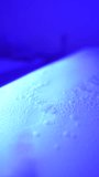 Macro close up of cosmetic massage bed with glowing water mattress and bubbling liquid, relaxing spa wellness technology background video - Powered by Shutterstock - Get 15% off with code: PIKWIZARD15