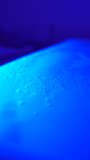 Macro close up of cosmetic massage bed with glowing water mattress and bubbling liquid, relaxing spa wellness technology background video - Powered by Shutterstock - Get 15% off with code: PIKWIZARD15