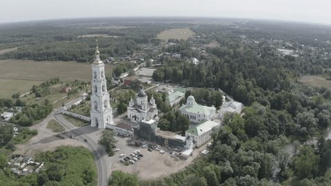 Drone Orbiting above Monastery River Landscape