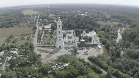 Drone Flying toward Monastery over Rural Landscape